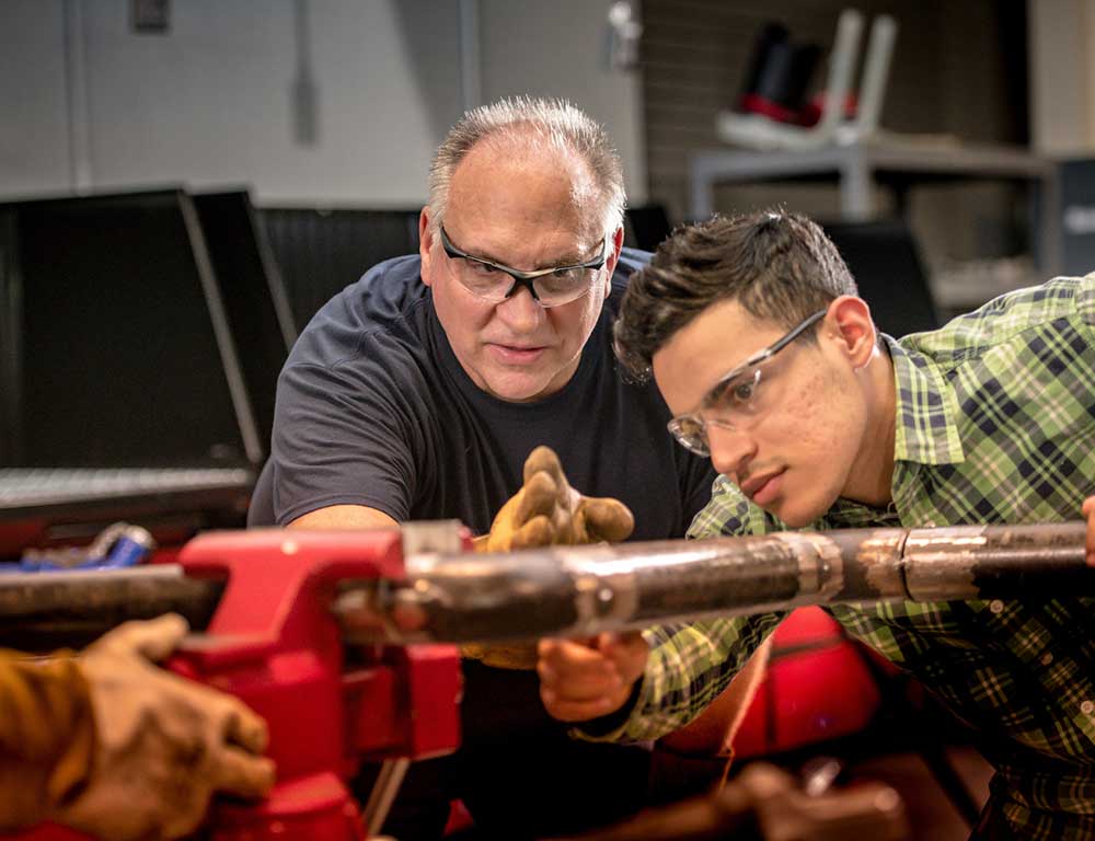 Pipefitting instructor and student
