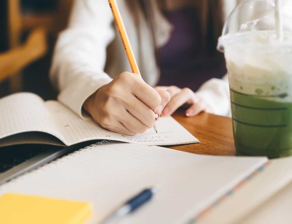 Student studying at the Corner Cafe