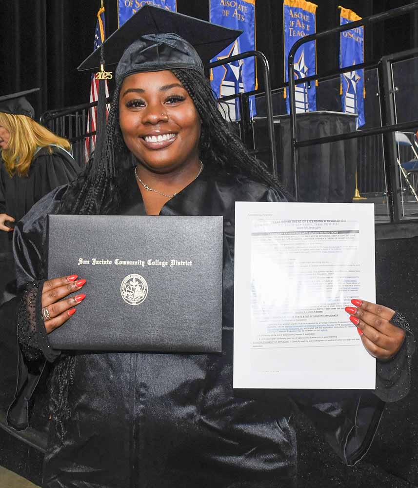 Cosmetology student receiving her diploma and her TDLR certificate