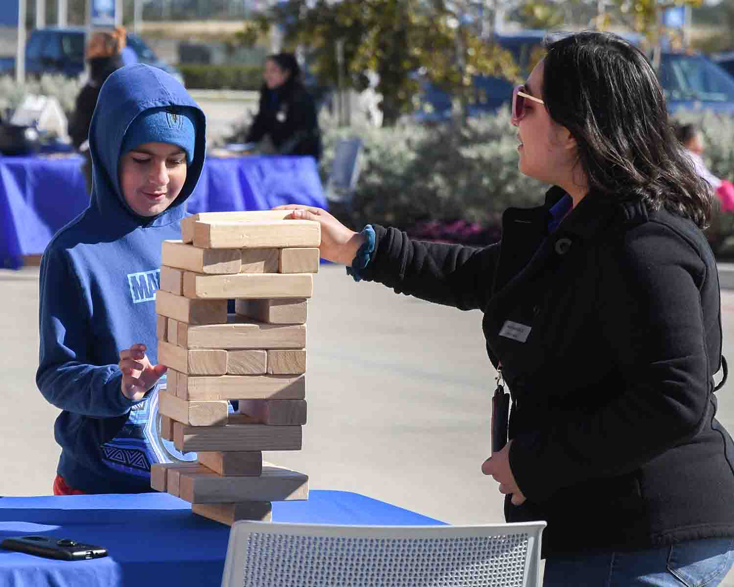 Yard Games - two people playing giant Jenga