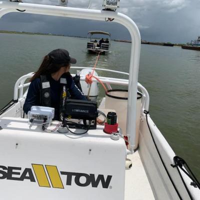 Jennifer Del Angel driving boat taxi